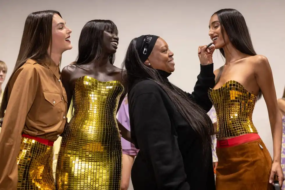 models backstage at fashion week with makeup artist pat mcgrath