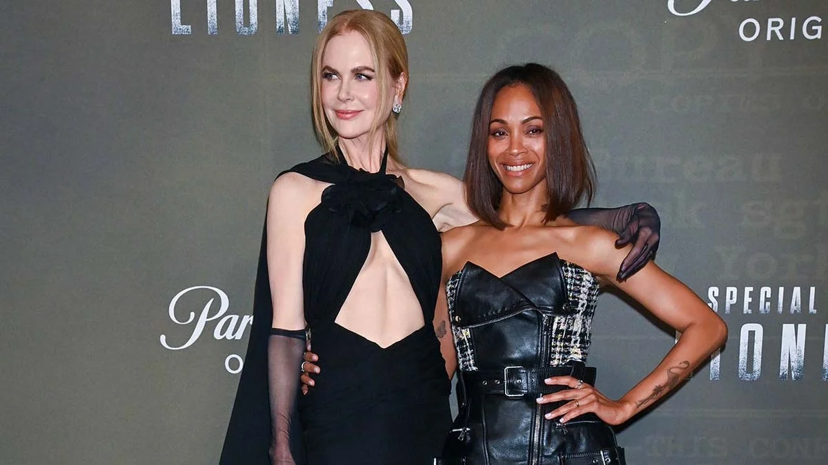 Zoe Saldana and Nicole Kidman with their arms around each other