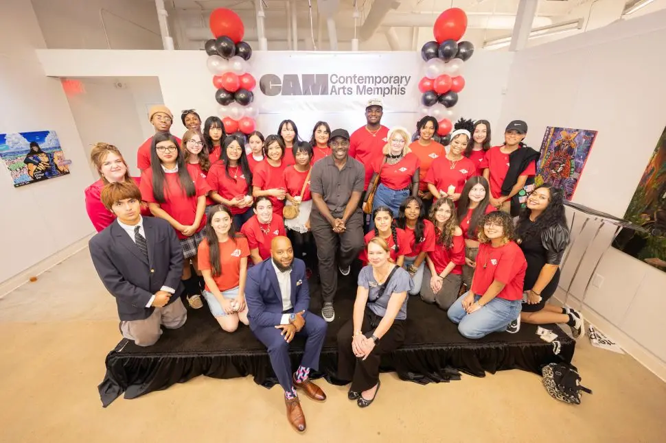 Image of a group of people in red tshirts.