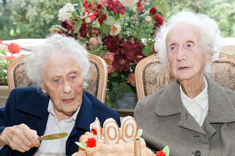 Marie Hendrix (L) and Gabrielle Vaudremer, 100-year-old Belgian twins celebrate their birthday with a cake in 2010.