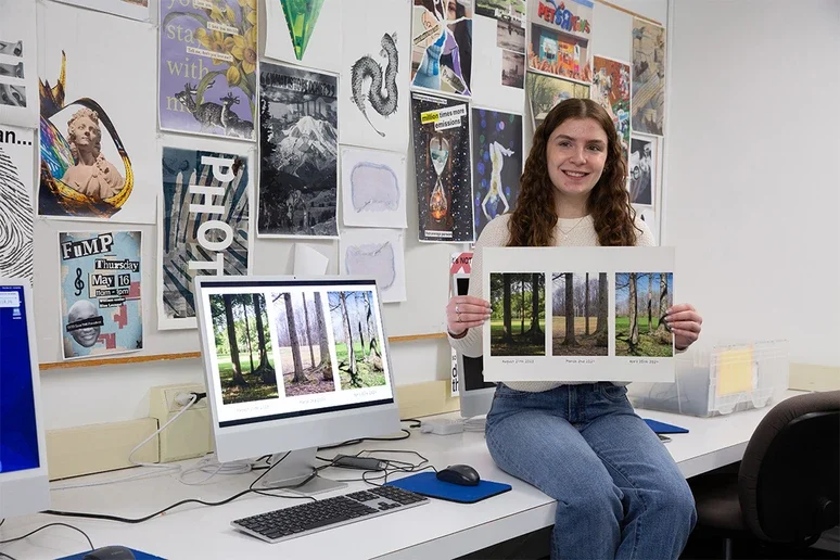 Rebecca Torncello holding a print of her photography