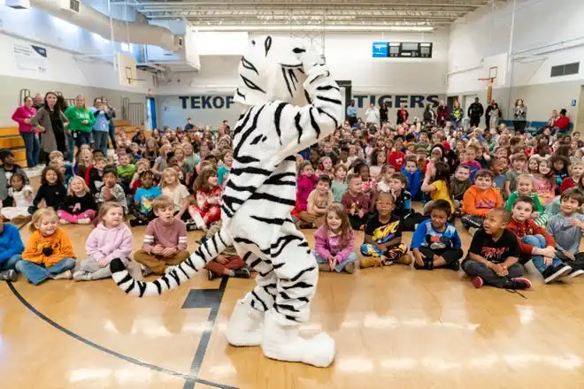 Tekoppel Elementary School mascot Tuffy hypes the crowd during the Pacers Sports & Entertainment 15th annual Big Toy Giveaway in Evansville, Ind., Thursday, Dec. 5, 2024.