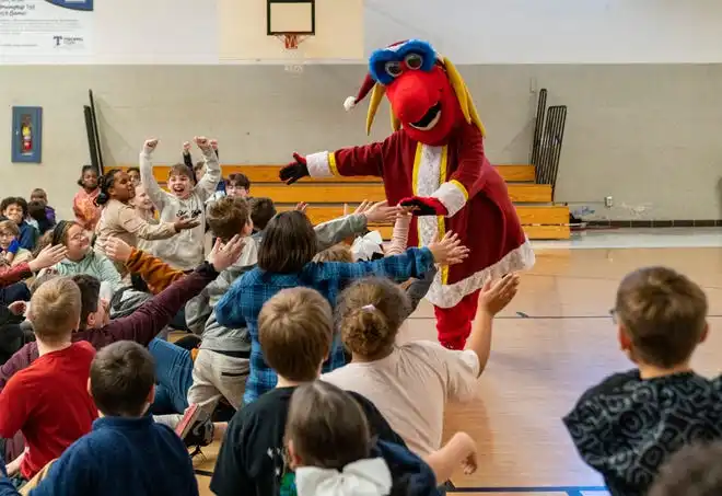 Indiana Fever mascot Freddy Fever hypes the crowd during the Pacers Sports & Entertainment 15th annual Big Toy Giveaway at Tekoppel Elementary School in Evansville, Ind., Thursday, Dec. 5, 2024.