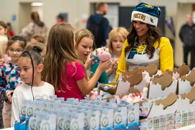 Kids pick out a toy during the Pacers Sports & Entertainment 15th annual Big Toy Giveaway at Tekoppel Elementary School in Evansville, Ind., Thursday, Dec. 5, 2024.