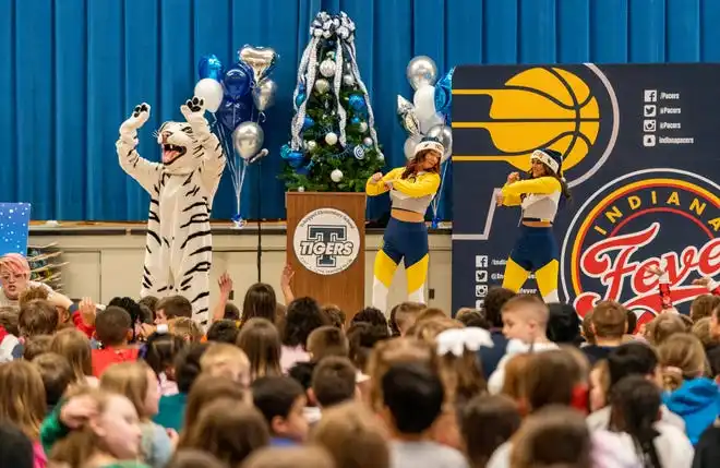 Tekoppel Elementary School mascot Tuffy and Pacemates Bridget and Brooke hype the crowd during the Pacers Sports & Entertainment 15th annual Big Toy Giveaway in Evansville, Ind., Thursday, Dec. 5, 2024.