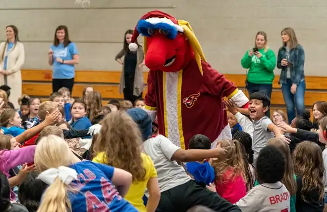 Indiana Fever mascot Freddy Fever hypes the crowd during the Pacers Sports & Entertainment 15th annual Big Toy Giveaway at Tekoppel Elementary School in Evansville, Ind., Thursday, Dec. 5, 2024.