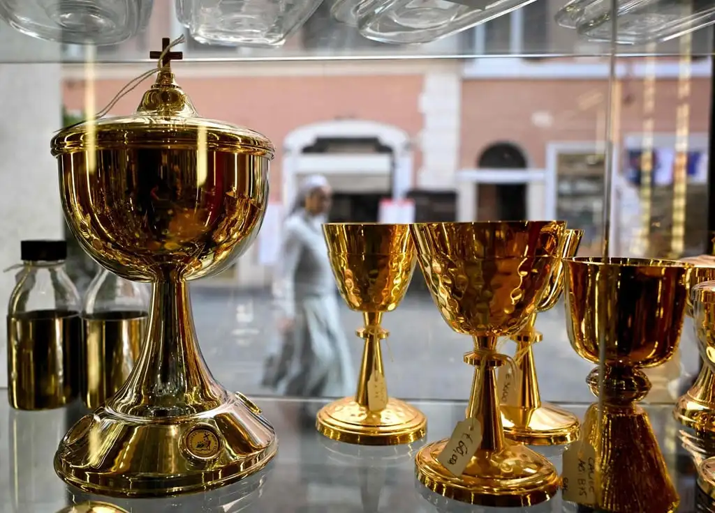 Ciboriums and chalices on sale at the shop of the Italian ecclesiastical tailor. Photo: AFP