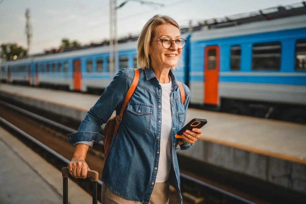 Mature woman wait for the train