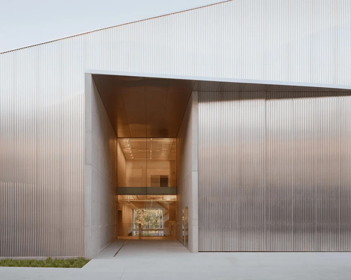 Powerhouse Castle Hill. Image: Rory Gardiner. The front entrance to Powerhouse Castle Hill, featuring a minimalistic silver-panelled architecture and large glass doors that also reveals the second floor.