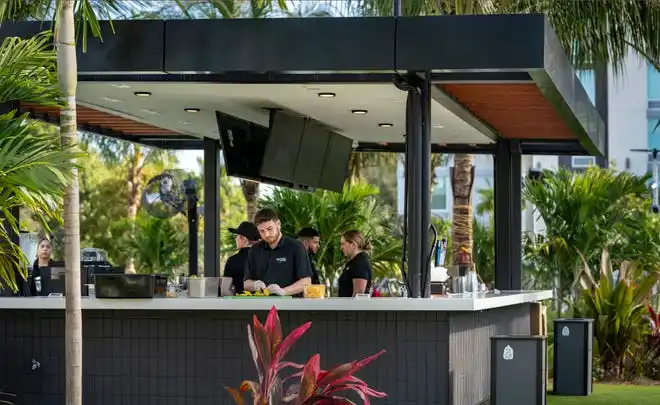 An outdoor bar at PopStroke that opened on December 20, 2024, in West Palm Beach, Florida. Tiger Woods, Greg Bartoliand TaylorMade Golf Company are the owners.