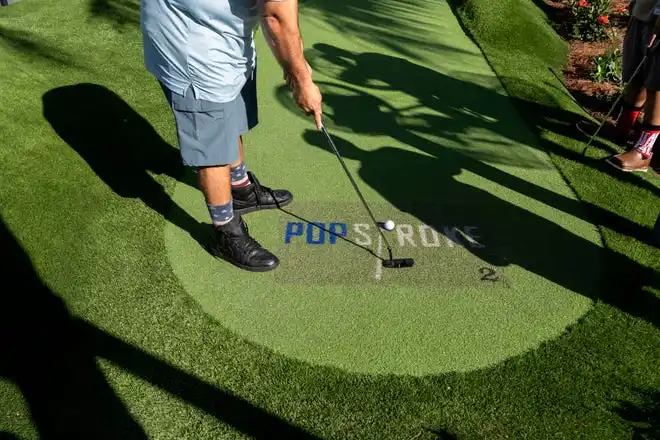 A customer putts the ball at PopStroke on December 20, 2024, in West Palm Beach, Florida. Tiger Woods, Greg Bartoliand TaylorMade Golf Company are the owners.