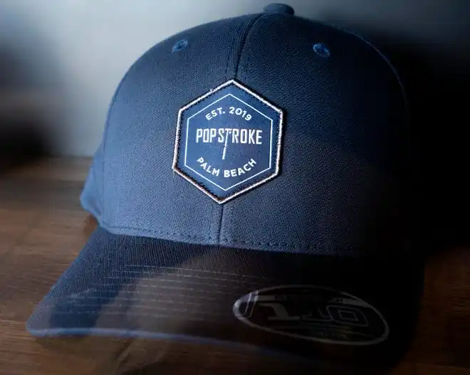 PopStroke hats for sale on December 20, 2024, in West Palm Beach, Florida. Tiger Woods, Greg Bartoliand TaylorMade Golf Company are the owners.