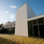 Forecourt Of Berlinische Galerie With Shining Yellow Field Of Letters On Black Asphalt, The Berlin State Museum, Berlin, Germany (Photo by: Insights/Universal Images Group via Getty Images)