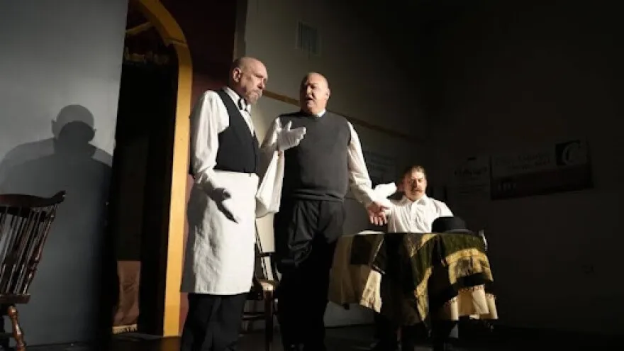 Three men on a stage at Corbin Theatre act in a play.