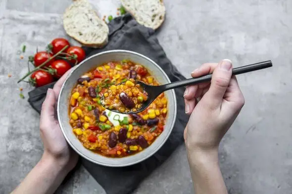 A bowl containing beans and vegetables