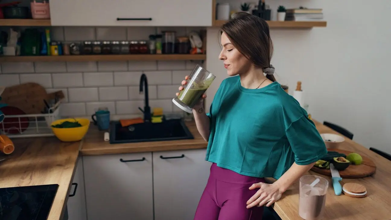 A female drinking a protein shake.