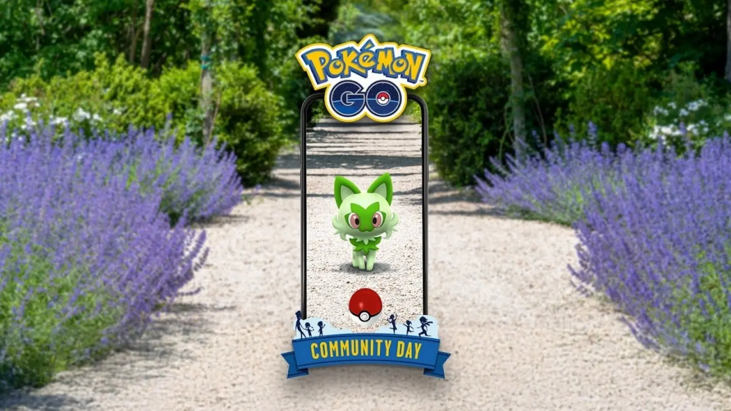 Text on the the image reads Pokémon GO Community Day. In the centre of the image a Sprigatito walks on a white gravel path, and looks towards the camera with a red Pokéball in front of it, in a phone frame as if you are encountering the Sprigatito in Pokémon GO. To the sides of the phone screen are lavender bushes and trees