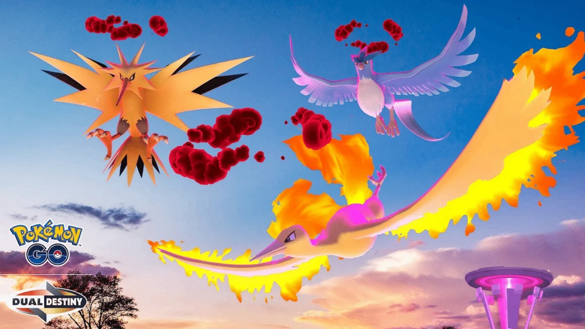 A clear sunset sky shows a Dynamax Zapdos, Dynamax Articuno and Dynamax Moltres in the sky, with a Power Spot in the background. Text in the bottom left reads 'Pokémon GO Dual Destiny'