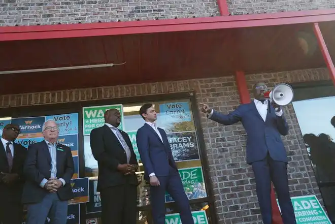 US Senator Raphael Warnock is joined by US House candidate Wade Herring, Savannah Mayor Van Johnson, and US Senator Jon Ossoff during a campaign event on Tuesday October 25, 2022 in Savannah Georgia.