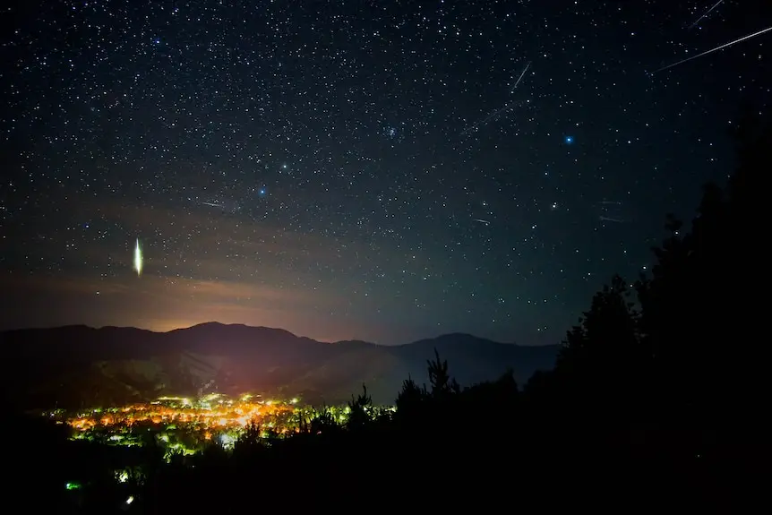 Sky over town of Bright, Victoria with meteors in sky