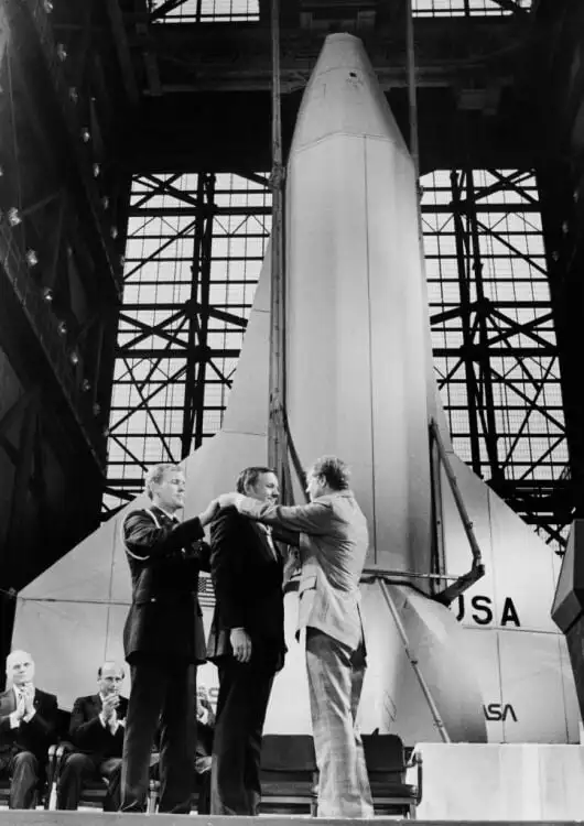 President Jimmy Carter placing Congressional Space Medal around NASA astronaut Neil Armstrong's neck