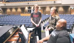 Rafeal McDaniels, LHS Director of Choirs and Co-Director of Theatre, leads Jared Pratt (Danny) and Sarah Lauwers (Sandy) in a rehearsal of “Summer Nights” from Grease: The Musical.