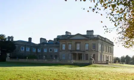 Stone mansion sitting in grassy parkland