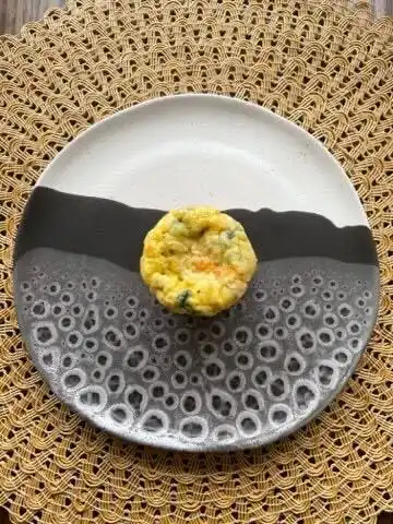 baked egg muffin on a decorative plate