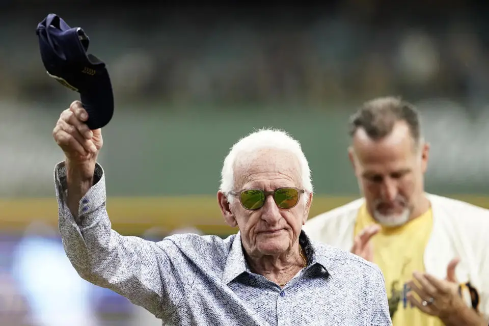 FILE - Milwaukee Brewers radio announcer Bob Uecker tips his cap before a baseball game between the Milwaukee Brewers and the Miami Marlins,, July 28, 2024, in Milwaukee. (AP Photo/Aaron Gash)