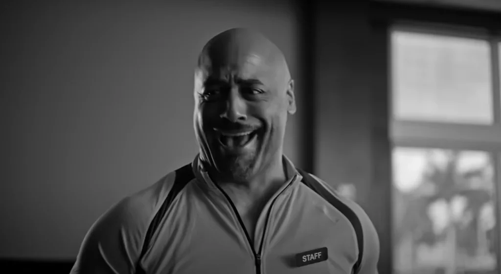 man plays a personal trainer in a gym commercial