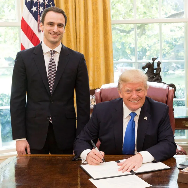 President Donald Trump with Michael Kratsios at his desk in the Oval Office in 2017.