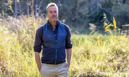 Ben Fogle standing in a field.