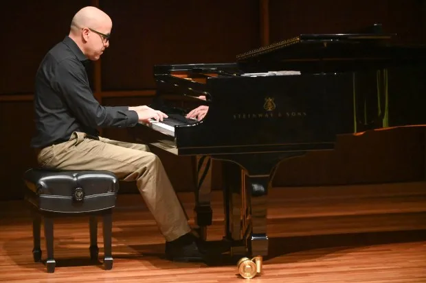 HCC faculty member, pianist Alan Blackman gives a performance during the announcement of the Howard County Arts and Culture Plan, held at Howard Community College's Horowitz Center on Thursday. (Brian Krista/Staff)