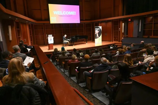 Guest listen as HCC faculty member, pianist Alan Blackman gives a performance during the announcement of the Howard County Arts and Culture Plan, held at Howard Community College's Horowitz Center on Thursday. (Brian Krista/Staff)