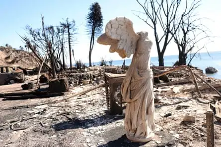 A sculpture is all that remains at a burned home in the aftermath of the Palisades fire along Pacific Coast Highway in Malibu, California on