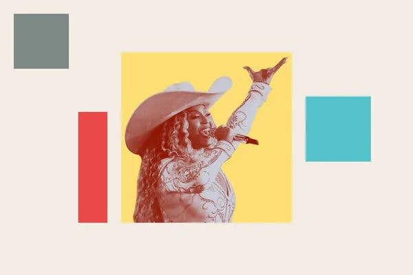 Beyoncé performs holding a microphone and wearing a cowboy hat. 