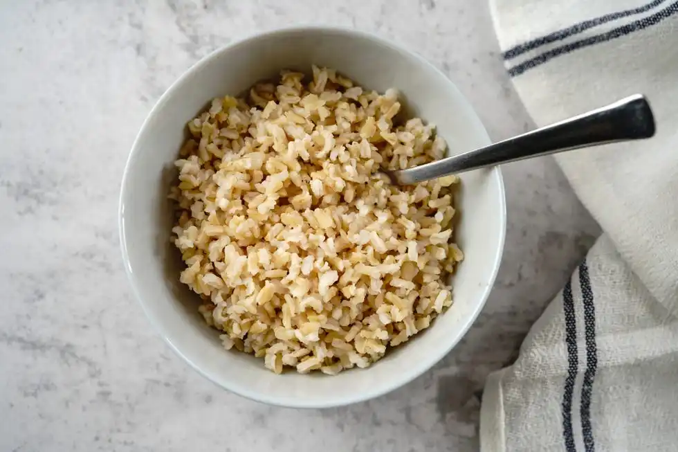 cooked brown rice served in a bowl