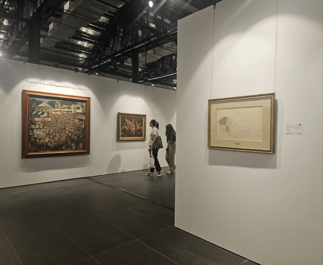 Visitors take a look at  artworks at Sotheby's Singapore on Jan. 14. (Park Yuna/The Korea Herald)