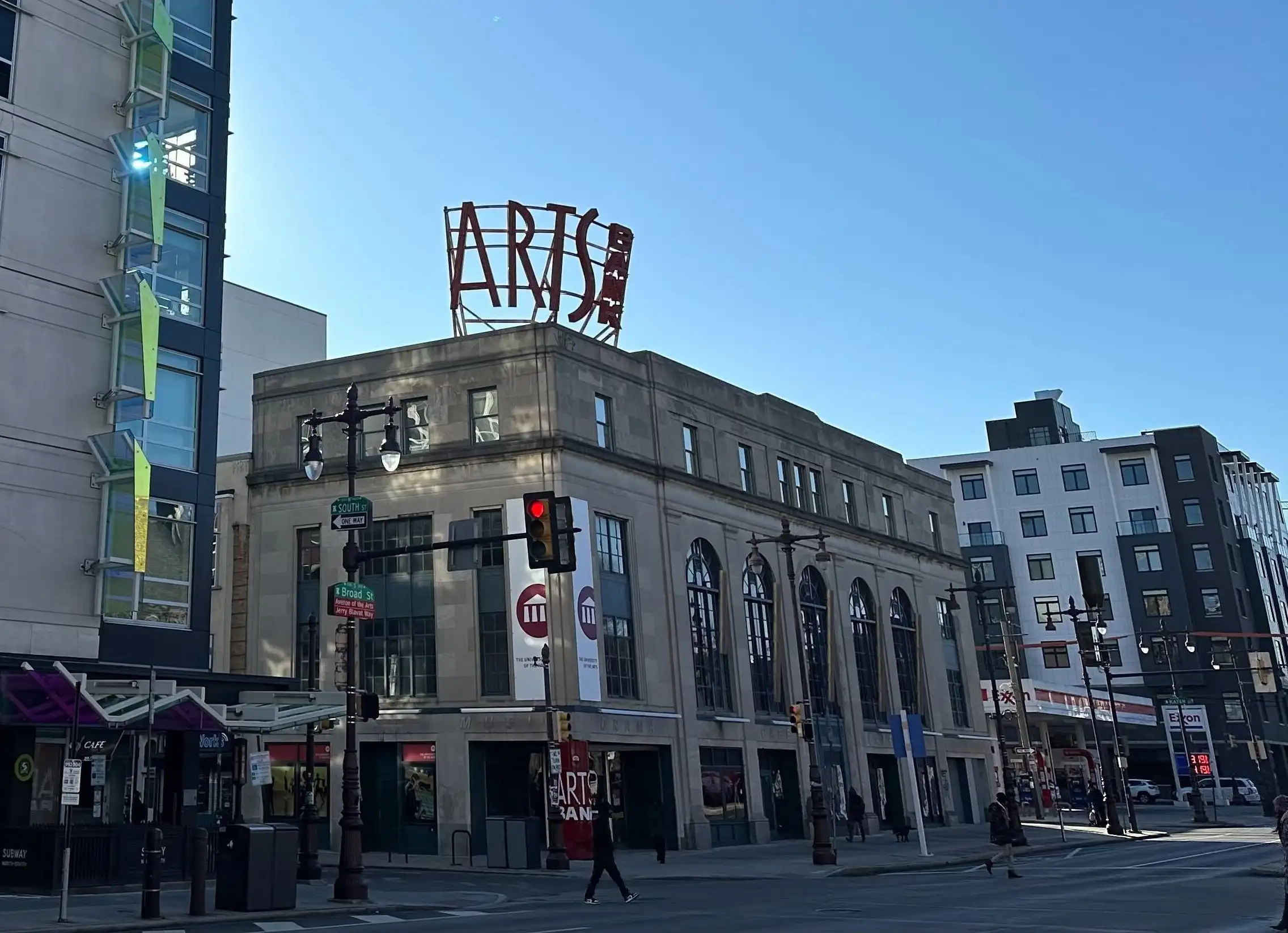 The Arts Bank building is shown on the corner of a busy intersection