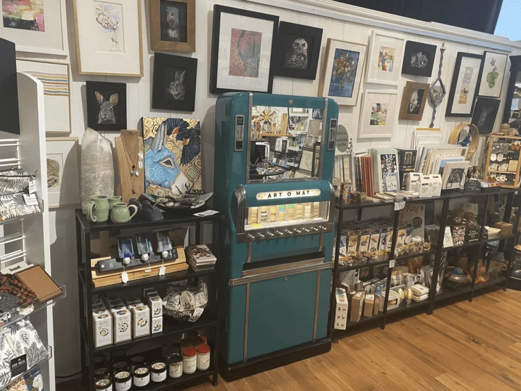 Art Center East's Gift Gallery sells handmade items by more than 40 artists. It also features the Art-o-Mat, a refurbished cigarette machine that now dispenses tiny artworks for $5 each. Photo by: Marc Mohan