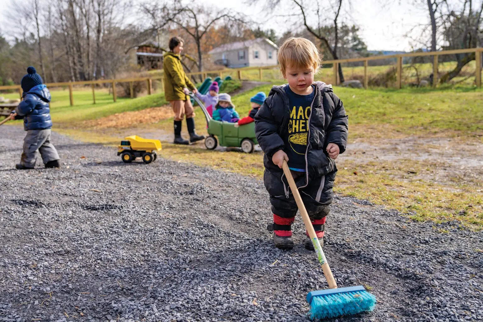 little boy plays outside