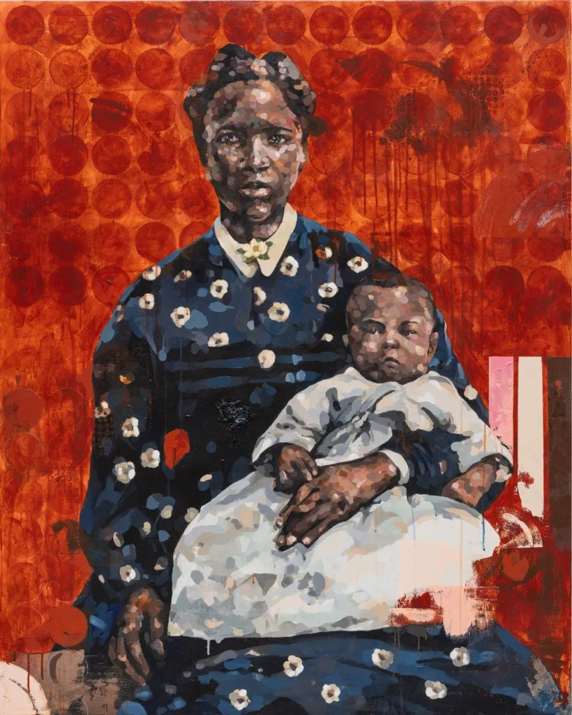 Portrait of a Black woman holding a baby on her lap. Red background