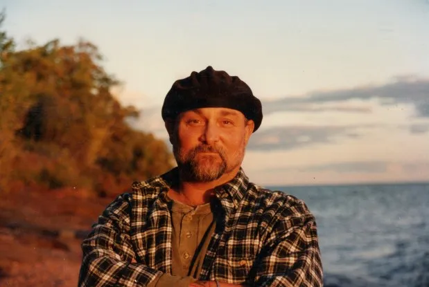 Artist William Murray poses for a photograph along Lake Superior in the late 1990s; the exact date is unknown. Murray, a longtime fine arts educator at the Minnesota Correctional Facility-Stillwater, was known for his detailed nature paintings inspired by the Boundary Waters. (Courtesy of Colin Murray)