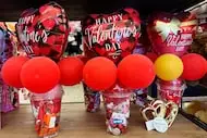 Valentine's Day balloons and chocolates are displayed at a grocery store in Glenview, Ill.,...