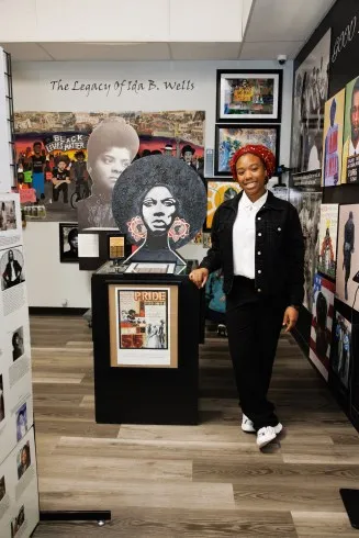 Youth docent and Sacramento City College student Myana Myrica in the Sojourner Truth African Heritage Museum. (Photo by Diane Mitchell)