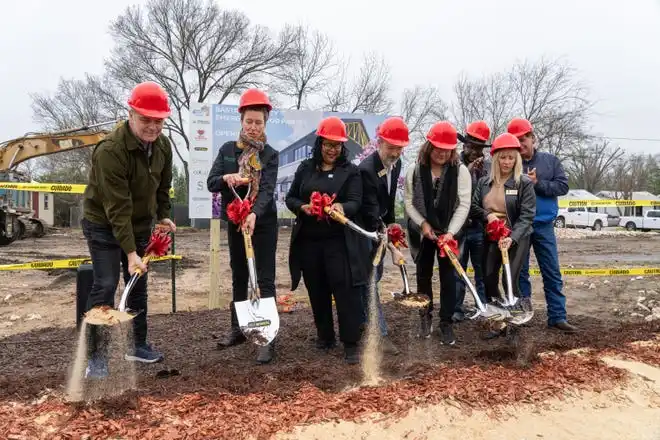 Tresha Silva, executive director of the Bastrop County Emergency Food Pantry, third from left, and city and county officials break ground on a new nutrition and education center Friday, Feb. 14, 2025. The new facility will feature a grocery store where neighbor’s can “shop” for their own food and will be able to double the inventory capacity of the Food Pantry to 1 million pounds.