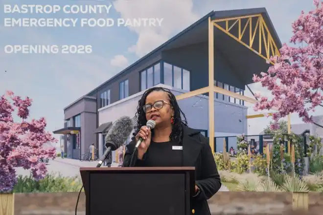 Tresha Silva, executive director of the Bastrop County Emergency Food Pantry, speaks to the crowd as the food pantry breaks ground on a new nutrition and education center Friday, Feb. 14, 2025. The new facility will feature a grocery store where neighbor’s can “shop” for their own food and will be able to double the inventory capacity of the Food Pantry to 1 million pounds.