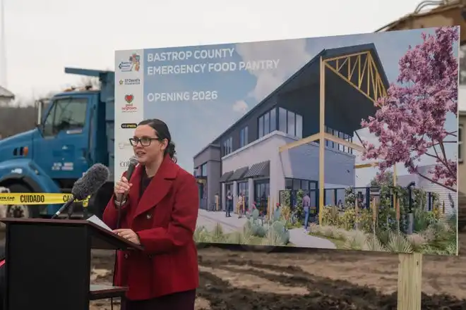 Kelly Manfredini, director of marketing and communications for Bastrop County Emergency Food Pantry, speaks as the food pantry breaks ground on a new nutrition and education center Friday, Feb. 14, 2025. The new facility will feature a grocery store where neighbor’s can “shop” for their own food and will be able to double the inventory capacity of the Food Pantry to 1 million pounds.