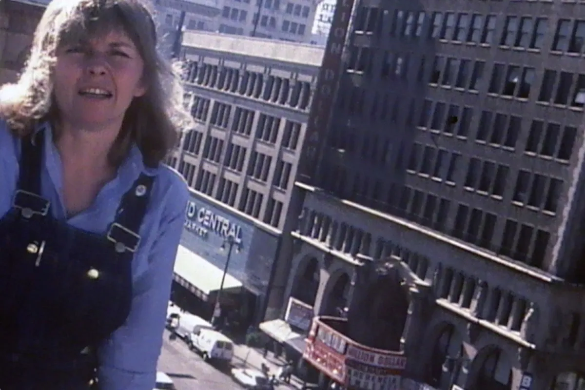 High Performance magazine editor Linda Frye Burnham on the roof of 240 Broadway loft building (1980) Still from the documentary Young Turks