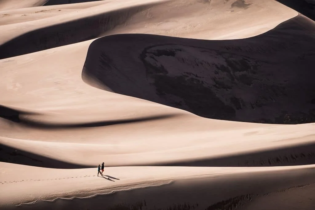 Walkers in Great Sand Dunes National Park, Colorado.